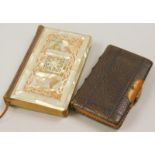 A pair of books, to include one example with part mother of pearl binding