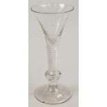 A late 18th/early 19thC wine glass, with tapering bowl, fine air twist stem and inverted baluster