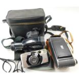 An Olympus IS-100 camera, in fitted case, a Kodak bellows camera and a Canon Prima Super 105