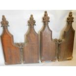 Four Victorian carved oak Gothic style pew ends, 131cm and 141cm high
