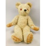 An English white mohair straw stuffed teddy bear, 69cm long