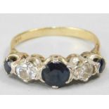 A sapphire and diamond five stone ring, three round brilliant cut sapphires, central stone approx.