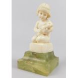 An Art Deco ivory figure by Ferdinand Preiss, carved in the form of a young girl holding a rabbit,