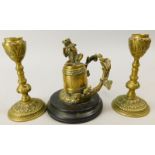 A 19thC bronze inkwell, cast with a bear playing a violin on top of a barrel, with stylised tree pen