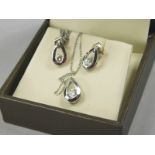 A 9ct white gold necklace and earring set, in a tear drop design set with tiny white stone, and a