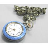 A silver and enamel fob watch, the fob watch in blue enamel with a raised floral design set with