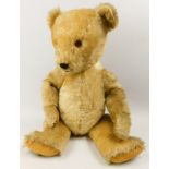 An English golden plush teddy bear, made by the Chilton Company, 63cm long