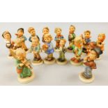 A collection of Goebel Hummel small figures, to include child playing a violin, boy with a teddy