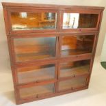 A Macey mahogany barrister sectional bookcase, with eight sliding glazed doors, on a plinth base,