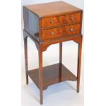A mahogany and ebony strung side cabinet, with two frieze drawers, on square tapering legs with