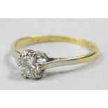 A diamond solitaire ring, with diamond approx 0.39cts, in a platinum setting, on a yellow metal