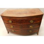 A George III mahogany bow fronted chest of drawers, the top with a moulded edge above a slide and