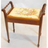 An Edwardian mahogany boxwood strung mahogany piano stool, with a hinged padded seat on square