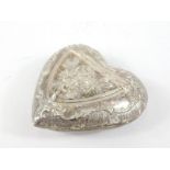 A 19thC Continental silver heart shaped pill box, decorated with scrolls etc., possibly Dutch,
