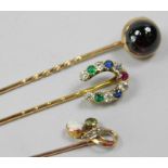 Three stick pins, to include a 9ct gold example set with seed pearl, peridot and opal, a 9ct