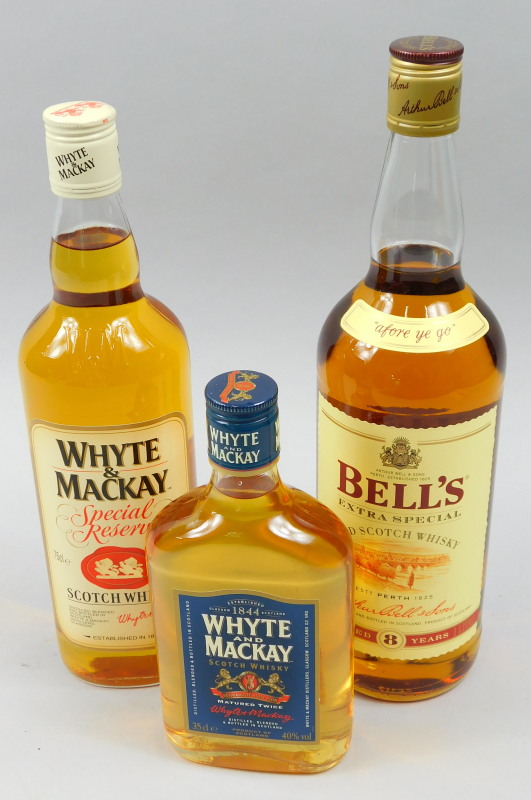 Three bottles of whisky, Bells 8 years matured, Whyte and Mackay Special reserve and a small