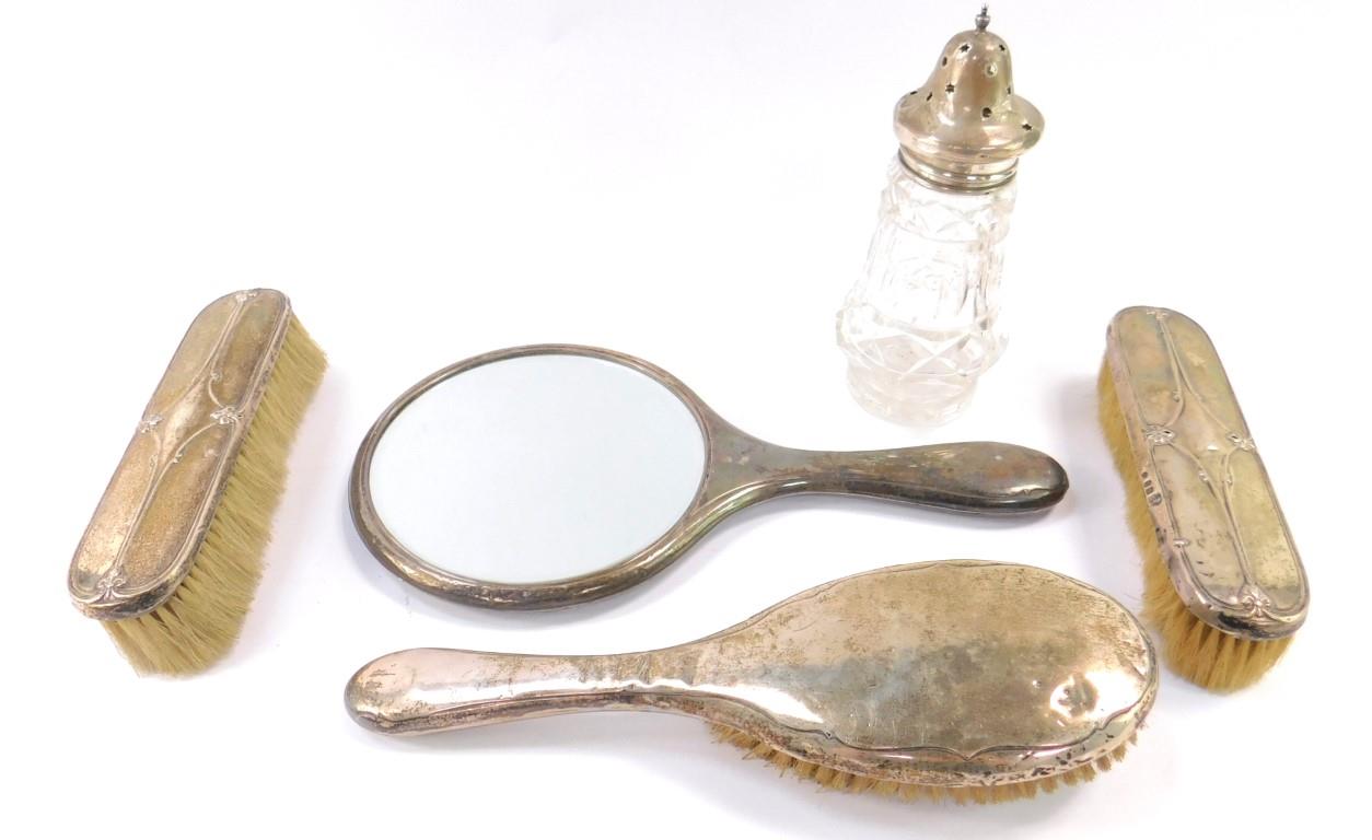 A pair of George V silver backed clothes brushes, Birmingham 1928, a silver backed hair brush and