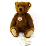 A 20thC German Steiff Teddy bear, with yellow label and stud to the ear, in brown with articulated