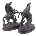 A pair of Marly horse figure groups, of classical gentlemen aside rearing horses, on naturalistic