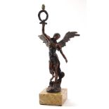 A cast metal figure of an Angel holding a garland, on a shaped marble finish base, with traces of