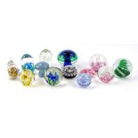 Various 20thC paperweights, to include a blue flower head example 8cm high, other swirl examples,