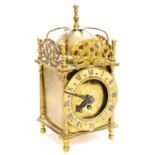 A mid 20thC Smiths brass lantern clock, with domed bell top, 1cm dia. Roman numeric chapter ring and