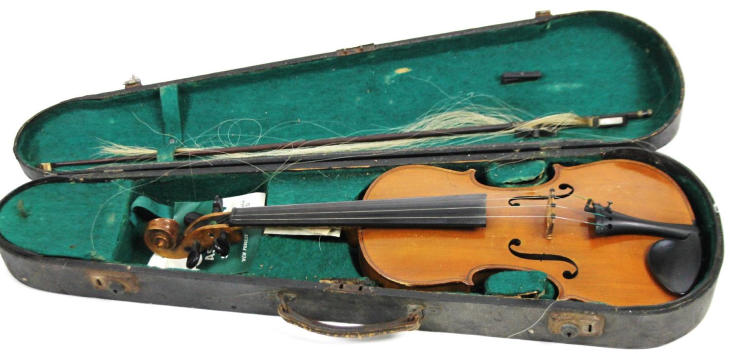 A 20thC pine violin, with two piece polished back, ebonised articulated tuning knops and a scroll