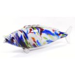 A 1970s Murano style glass fish, vibrantly decorated predominately in red, blue and green on a white