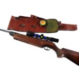 A German .55 calibre air rifle marked HW80, 116cm wide, with sight and outer case.