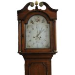 A early 19thC oak country longcase clock, with a mahogany crossbanding, the swan neck pedimented