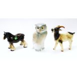 A 20thC Goebel figure of a goat, in cream colour way, blue marks beneath, 16cm high, Nao figure of