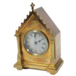 An early 20thC polished brass mantel clock, the architectural case holding a 7cm dia. Roman