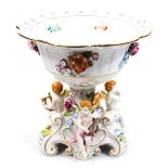 A mid 20thC Schierholz porcelain centre piece, the floral central dish holder raised with petals and