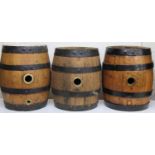 Various early 20thC oak plank coopered barrels, to include a purification barrel with four sectional