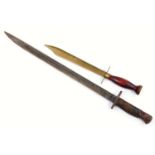 An 1887 pattern bayonet, with shaped blade and handle with metal pommel, 54cm wide, and a further