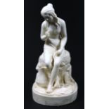 A Copeland style Parian figure of a lady, seated on a part gadrooned naturalistic base, unmarked