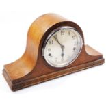 An early 20thC oak Napoleon Hat mantel clock, the 15cm dia. Arabic dial revealing a keywind movement