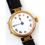 A 9ct gold wristwatch, with circular watch head, with black and red Roman numerals, on black