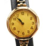 An early 20thC ladies cocktail watch, with 2cm dia. dial, the strap marked 9ct rolled gold.