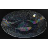 An opalescent moulded glass bowl, decorated with flowers and swirls, probably French, 39cm wide.