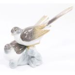 A 20thC Lladro figure group of two birds, E-3AG, printed and impressed marks beneath, 19cm high.