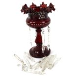 A Victorian ruby glass single lustre, the flared handkerchief top raised on a dumbell stem and