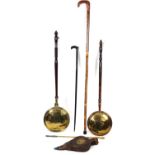 An early 20thC brass warming pan, with turned wooden handle, 111cm wide, heavy walking stick with