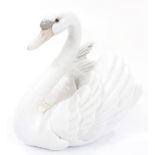 A 20thC Lladro figure of a swan, no.5231, printed and impressed marks beneath, 18cm high.