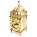 A mid 20thC Smiths Brass miniature lantern clock, with domed bell top, front 8cm dia. chapter ring