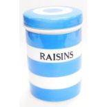 A mid 20thC TG Green Cornish ware blue and white jar, marked Raisins, with a removable lid, black