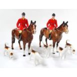 A Beswick red jacketed huntsman on brown horse, printed mark beneath, 22cm high, another similar and