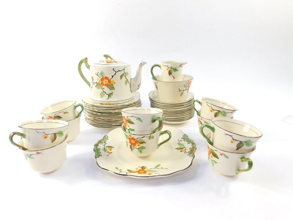 A Thomas Forrester & Sons Pheonix ware tea service, decorated in the Blossom pattern, comprising