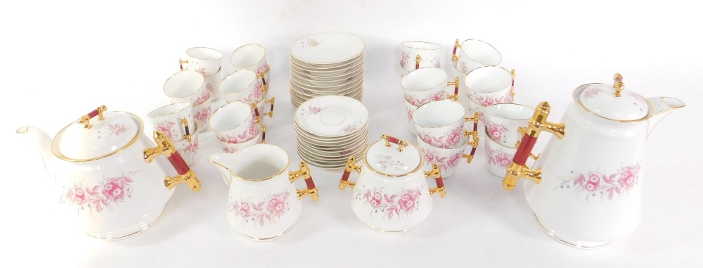 An Altwasser porcelain tea and coffee service, decorated with floral sprays, comprising a teapot,