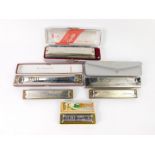 Six Hohner harmonicas, some boxed, comprising the Larry Adler professional sixteen, echo, two song